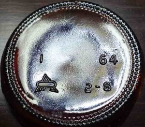 American Can Company- Glass Products Division trademark on base of amber beer or soda bottle bearing 1964 date code