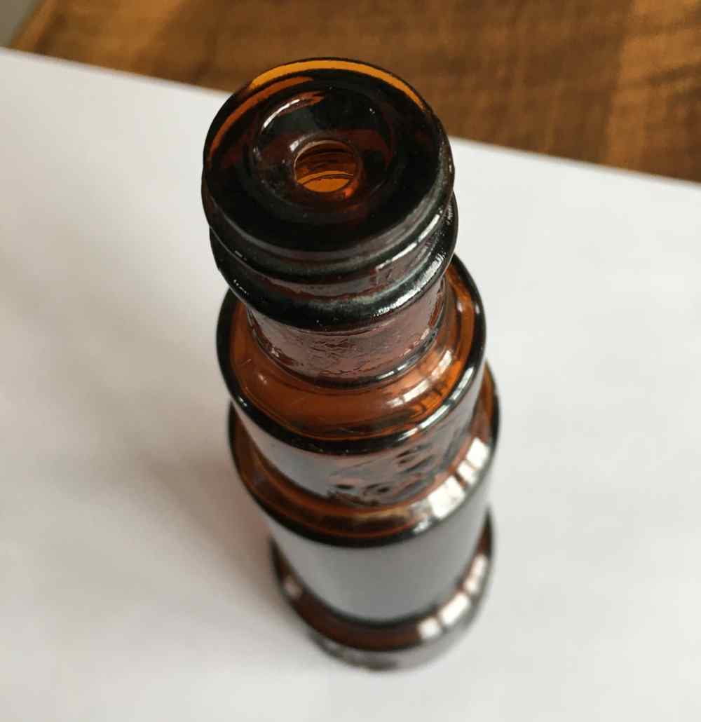Top view of amber telescope-shaped bottle (Photo courtesy of Jane Roth).