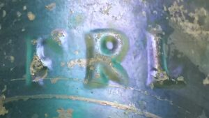 "F R L" mark on reverse lower side of antique "H. GRONE & Co. St. LOUIS Mo" blob top soda bottle in light aqua (iridescent sheen from long burial). FRL stands for Frederick R. Lorenz of Pittsburgh, PA. "F R L" mark on reverse lower side of antique "H. GRONE & Co. St. LOUIS Mo" blob top soda bottle in light aqua (iridescent sheen from long burial). FRL stands for Frederick R. Lorenz of Pittsburgh, PA.