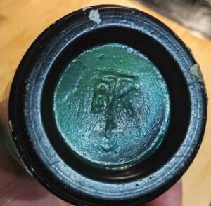 BTK marking on base of teal aqua-green bottle (Photo courtesy of Eric Hulten).