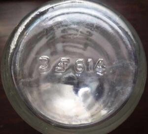 FF -mark used by Foster-Forbes Glass Company - on base of clear HALITOSINE bottle. "3" is mold number and "614" is a mold design number.