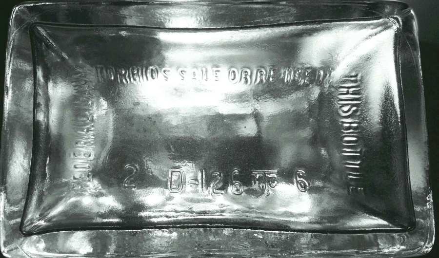 Base of SEAGRAM'S SEVEN CROWN liquor decanter, made by Thatcher Glass. "2" is the liquor bottle permit number" to the left of the Thatcher logo.  "6" is the date code, probably standing for 1966.