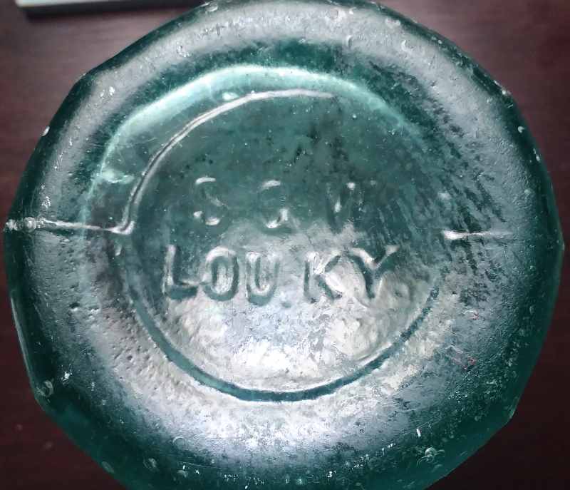 S.G.W. LOU. KY. mark on base of aqua "K. C. & Co" soda/mineral water bottle made by Southern Glass Works. 