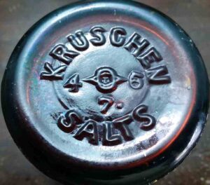 Base of amber KRUSCHEN SALTS jar - made by Owens-Illinois Glass Company - Clarksburg, West Virginia plant -1936. "7" is a mold number.