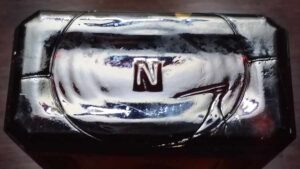 "N" mark on base of amber glass Winstead's LAX-FOS laxative bottle - Obear-Nester Glass Company.