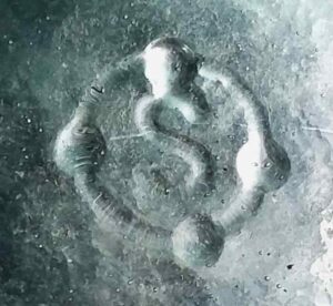 "S inside a circle with 4 dots", on the base of a light aqua blob-top "champagne beer" style bottle.