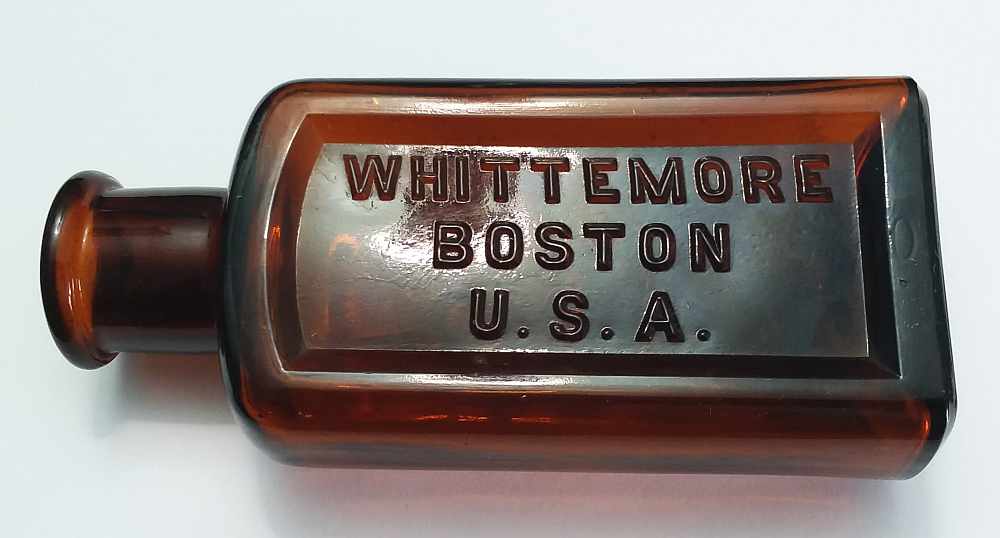 Dark Amber Whittemore Bros bottle - rectangular five ounce size, mold # 12 on the base. Tooled lip, this may date from the 1880s-1890s.