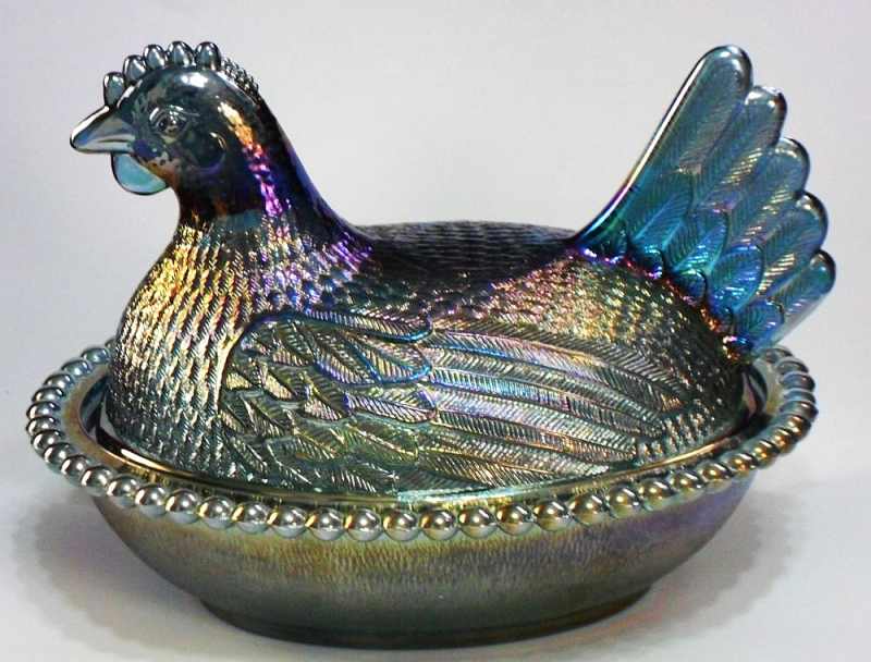 Indiana Glass Company hen in Blue Carnival Glass or "Iridescent Blue". These were made in the 1970s. Indiana Glass Company "Hen on Nest" candy dish in Blue Carnival (Iridescent)