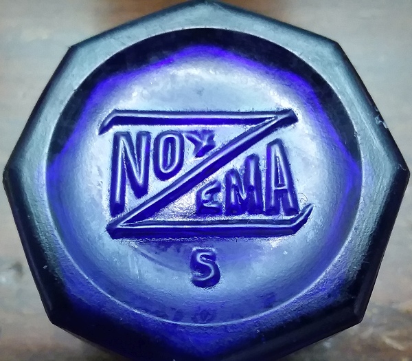 Base of NOXZEMA cream jar - made by Maryland Glass Corporation - this jar is two inches tall and 1 & 3/4ths inches in diameter -octagon shape. The "5" is a mold number. Base of NOXZEMA cream jar - made by Maryland Glass Corporation - this jar is two inches tall and 1&3/4ths inches in diameter -octagon shape. The "5" is a mold number.