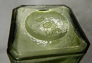 "D O C" base mark on Citron colored square pickle bottle made by Dominic O. Cunningham of Pittsburgh PA. (photo from Worthpoint, unidentified eBay seller)