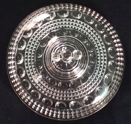 "Banded Raindrop" pattern - compote lid (7 & 1/2 inches diameter). This pattern was made by Beaver Falls Glass Company, Beaver Falls, PA (produced c.1887-c.1891) and also by Ohio Flint Glass Company, Bowling Green, Ohio (c. 1891-1892?). "Banded Raindrop" pattern compote lid (7 & 1/2 inches diameter). This pattern was made by Beaver Falls Glass Company, Beaver Falls, PA (produced c.1887-c.1891) and by Ohio Flint Glass Company, Bowling Green, Ohio (c. 1891-1892?).