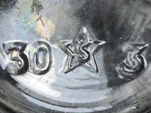 "S in a star" - Southern Glass Company, Los Angeles, CA. Here on the base of crown top General Foods bottle - "30" is a date code for 1930. (Photo courtesy of Tom K). 