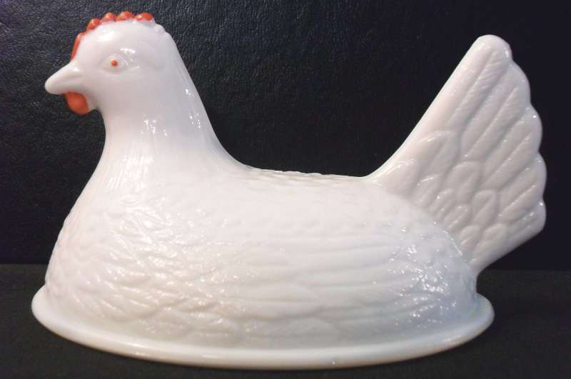 Small size hen (top only) in white milkglass. This type was made by Hocking Glass Company. Small size hen on nest dish (top only, about 4.5 inches) in white milk glass. This was probably made by Hocking Glass Company, although credited to Indiana Glass for many years.