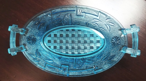 Canton Glass Company, Canton, Ohio and Marion, Indiana - blue "No. 10" (original pattern name) pickle or relish dish. This pattern is more commonly known as "Barred Forget-Me-Not" and was introduced in 1885. This probably dates circa 1885-1888. Many different glass tableware items were made in this pattern by Canton, in several colors. Canton Glass Company, Canton, Ohio and Marion, Indiana - blue "No. 10" pattern relish or olive dish. This pattern is more commonly known as "Barred Forget-Me-Not" and dates from circa 1885-1888. many different glass tableware items were made in this pattern, in several colors.