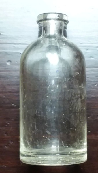 Small serum/vaccine type bottle marked "PYREX" on base. This measures only 2.25 inches tall.