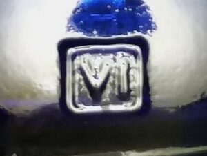 VI inside rectangle - Verallia Italia - mark seen on heel of cobalt blue beverage bottle.