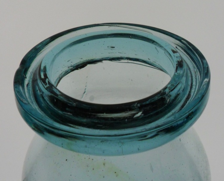 Aqua Wax sealer grooved ring lip - this is the top of a typical wax sealer style antique glass fruit jar. Aqua Wax sealer grooved ring lip - this is the top of a typical wax sealer style antique glass fruit jar.