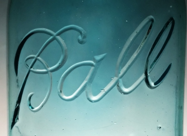"BALL" logo 6, on the front of a "Ball Blue" Ball Perfect Mason jar. Note this logo variant is probably the most common variant seen on the early "colored" BPM jars (usually in aqua or Ball Blue glass, not clear) and this logo was used from approximately 1923 to 1933. This variant is characterized by NO "ascender stroke" to left of the "a", and there is NO underline. This variation can be easily identified even from a short distance. (See chart below) "BALL" logo 6, on the front of a "Ball Blue" colored "Ball Perfect Mason" jar. Note this logo variant is probably the most common logo variant seen on the early "colored" jars (usually in aqua or Ball Blue, not clear) and this logo was used from approximately 1923 to 1933. The logo is characterized by NO "ascender stroke" to left of the "a", and there is NO underline. This variation can be easily identified even from a short distance. (See chart below)