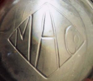 M A Co within diamond (on base of clear glass shaving mug) M A Co within diamond (on base of clear glass shaving mug). This is of uncertain date, but possibly from the 1900-1930 era.